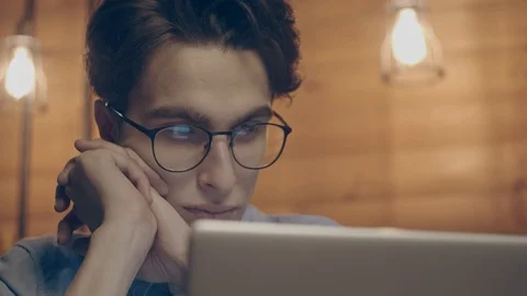 Young man working with laptop Stock Footage 125080604