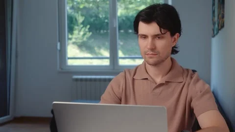 Young Man Working on Laptop at Home Stock Footage 342323902