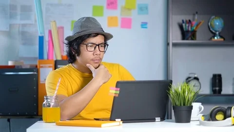 Young Man Working With Laptop on Summer Vacation Season at Office Slow Motion Video stock 91471532