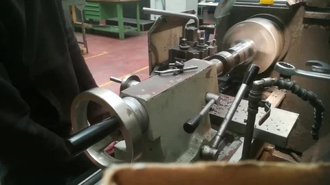 A young man working on a lathe Stock Footage 83139091