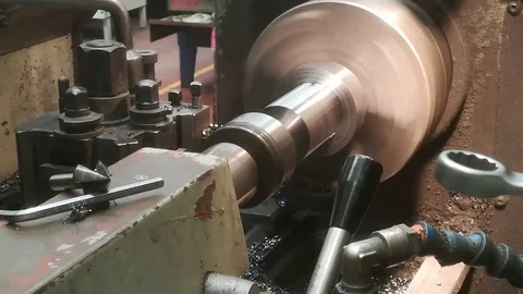 A young man working on a lathe Stock Footage 83139490