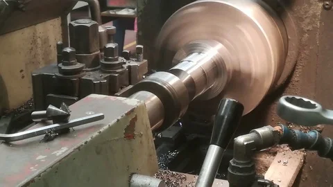 A young man working on a lathe Stock Footage 83142199