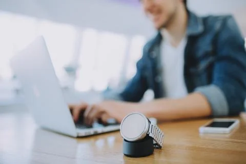 Young man working on a macbook or laptop in cafe Stock Photos