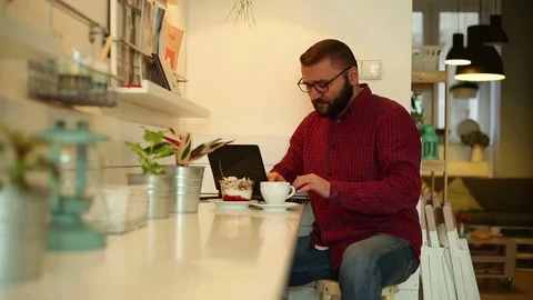 Young man working on modern laptop in cafe  Stock Footage 70859101