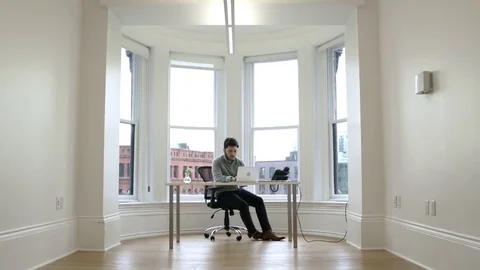 Young man working in an office 動画素材 77080930