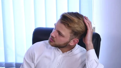 Young Man working in office Stock Footage 77133890