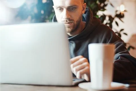 Young man working on PC pc in co-working Stock Photos