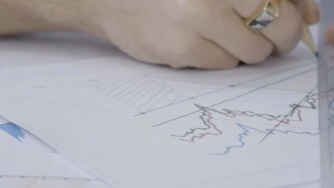 Young man is working with project documentation sitting in modern office. Stock Footage 85633378