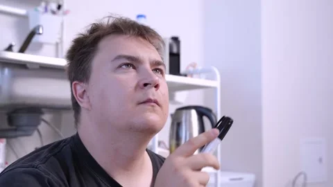 Young man is working on project or plan and making complex calculations with Stock Footage 133202232