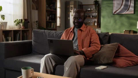 Young Man Working Remotely on Laptop at Home Stock Footage 345145753
