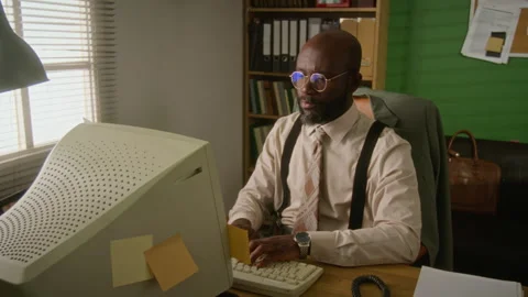Young Man Working on Retro Computer in Vintage Office Stock Footage 341421875