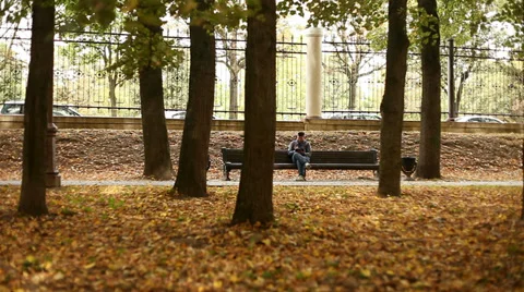 Young man working on tablet computer in city park, 1080p Stock Footage 28507606
