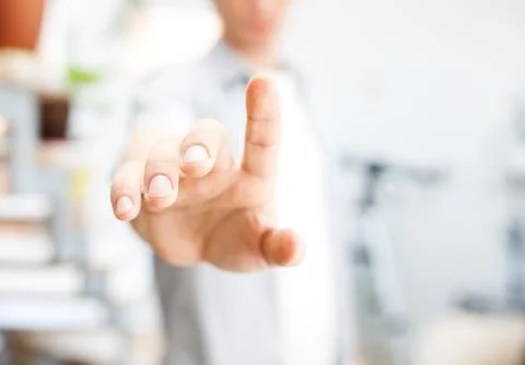 Young man working with virtual screen or pushing button Stock Photos