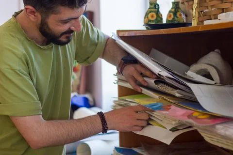 The young man working in workshop Stock Photos