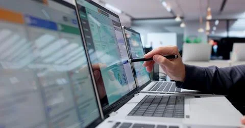 Young Man Works On Cloud ERP System Using Laptop For Business Management. Stock Photos