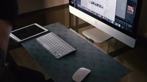 Young man works on the computer and a tablet Stock Footage 62068929