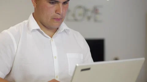 Young man works on computer in home close up 스톡 동영상 64340171