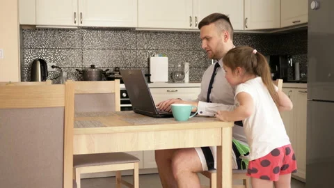 Young man works at the computer at home because of the quarantine. Little Video stock 128432679