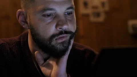 Young man works on the computer at night Video stock 152772582