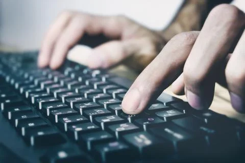 Young man works with computer Stock Photos