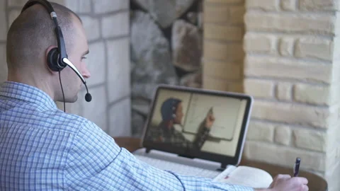 A young man works at a computer. Telework. Work from home. Stock Footage 147565167
