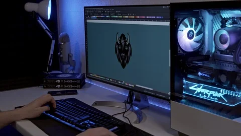 A young man works at a computer at this time he receives a notification on t Stock Footage 127060285