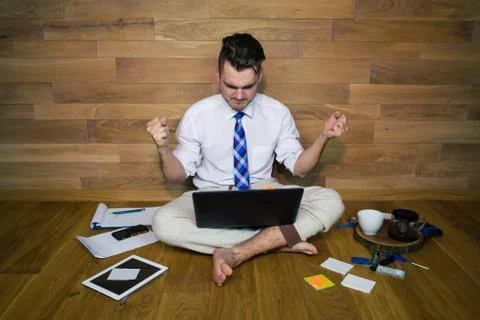 Young man works at home Stock Photos