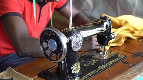 A Young Man Works at a Sewing Machine co Stock Footage 115661966