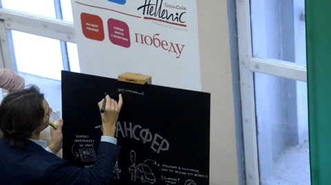 Young man write on the blackboard Stock-Footage 44349431