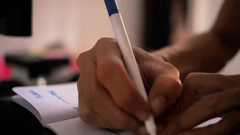 A young man writes a journal Stock Footage 289696451