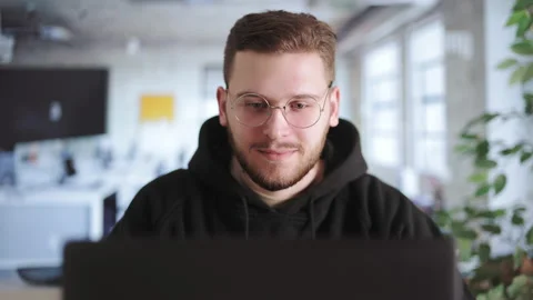 Young man writing code on laptop Stock Footage 196765994