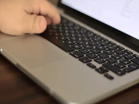 Young man writing on a laptop 動画素材 71315855