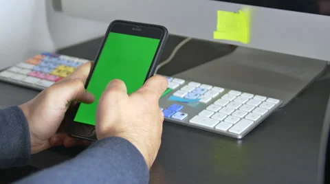 Young Man Writing Mail Or Message On His Smartphone, Green Screen Stock Footage 64044690