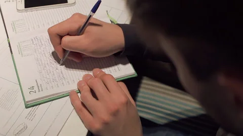 Young man writing in notepad in cafe, close-up Stock Footage 63067590