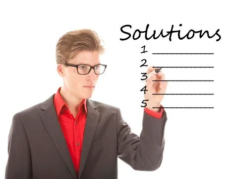 Young man writing solution items isolated on white background Stock Photos