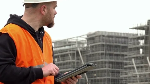 Young manager controls the project on tablet Stock Footage 72324201