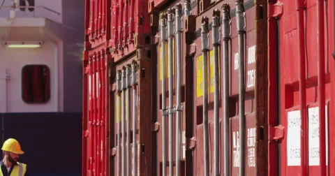 A young manager doing inspection rounds through an industrial harbor . Stock Footage 55200505