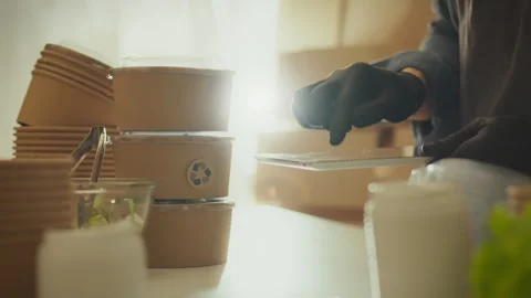 A young manager dressed in work clothes carefully works with a touchscreen t Stock Footage 266806877