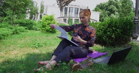 Young manager performs work near the office while in the park 3 Stock Footage 112291887