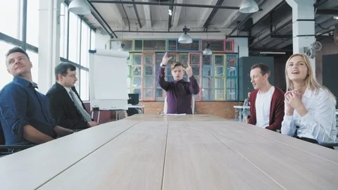 The young manager is sitting at a big table in a good mood, waiting for the Stock Footage 108374729