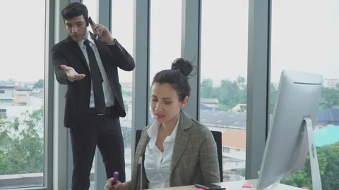 The young manager is talking about work with his young secretary. Stock Footage 119218234