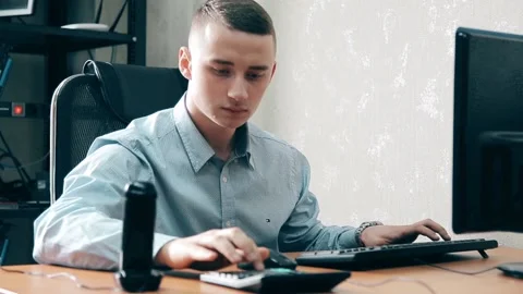 The young Manager is trying to talk on two phones at the same time Video stock 88468518