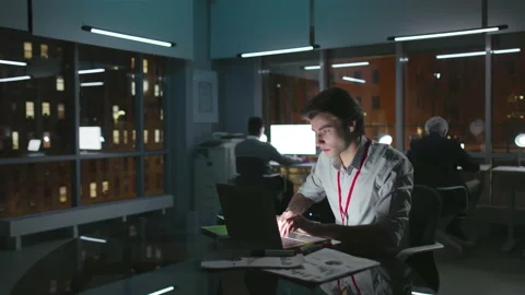 Young manager work on computer in loft office downtown with old buildings view Stock Footage 176191473