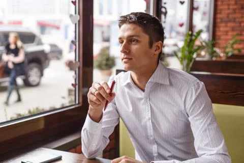 Young manager working writes in a notebook outdoors Foto stock