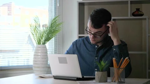 A young manager works on a computer Stock Footage 275888879