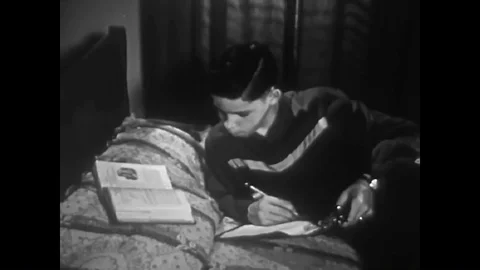 A young mans conscious begins to make him feel guilty for cheating on his math Stock Footage 99411246