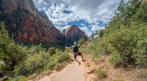 Young mans epic summit to Angels Landing trail - Zion National Park Stock Photos