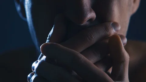Young man's face screaming with hands covering mouth, close-up Stock-Footage 106593830