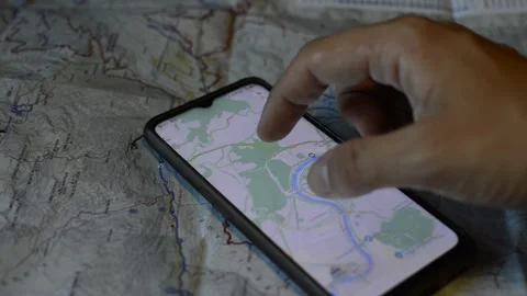 Young man's hand use google gps app and map for travel. phone gps app Stock-Footage 200125021