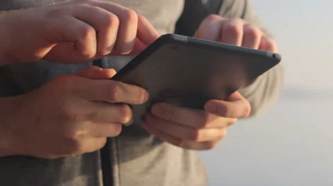 Young mans hands touch a tablet. 스톡 동영상 55336899